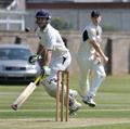 Craig Wallace survives a run-out attempt as the throw from Ali Evans is off-target.jpg